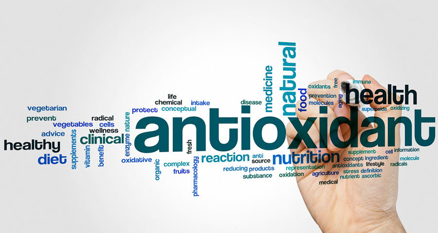 Anioxidant - a hand writing the word Antioxidant over a transparent surface