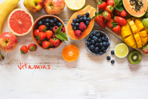 Vitamins - a image of dozens of fruits over a table