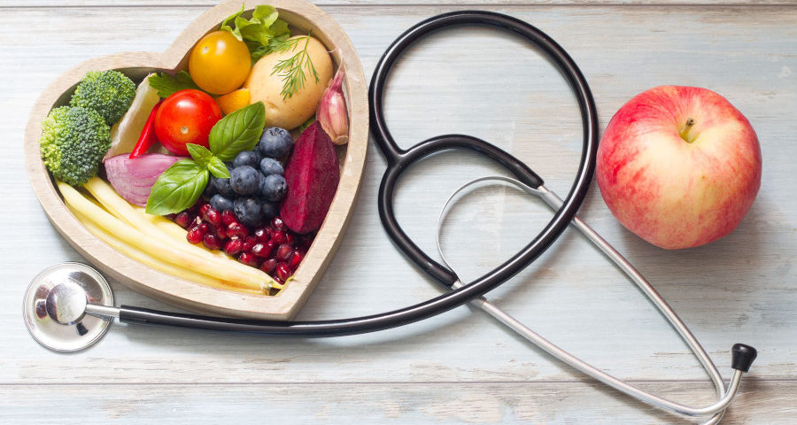 7 food you should eat every day - image of a bowl heart shaped full of fruits