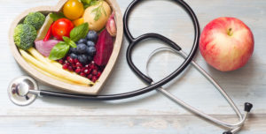 7 food you should eat every day - image of a bowl heart shaped full of fruits