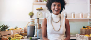 15 tips to Start an Acai Bowl Business - A young entepreneur woman with a confident smile at her café