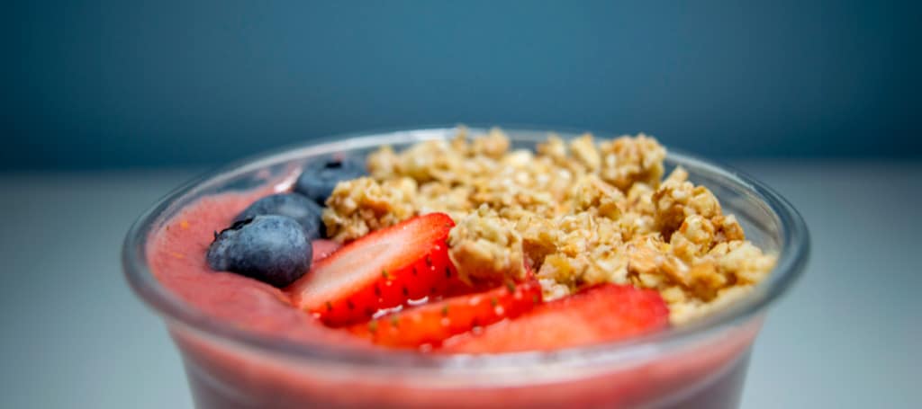 A cup of açaí with fruits