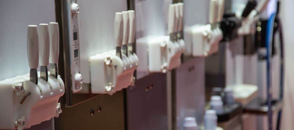 Row of soft-serve machines in a shop